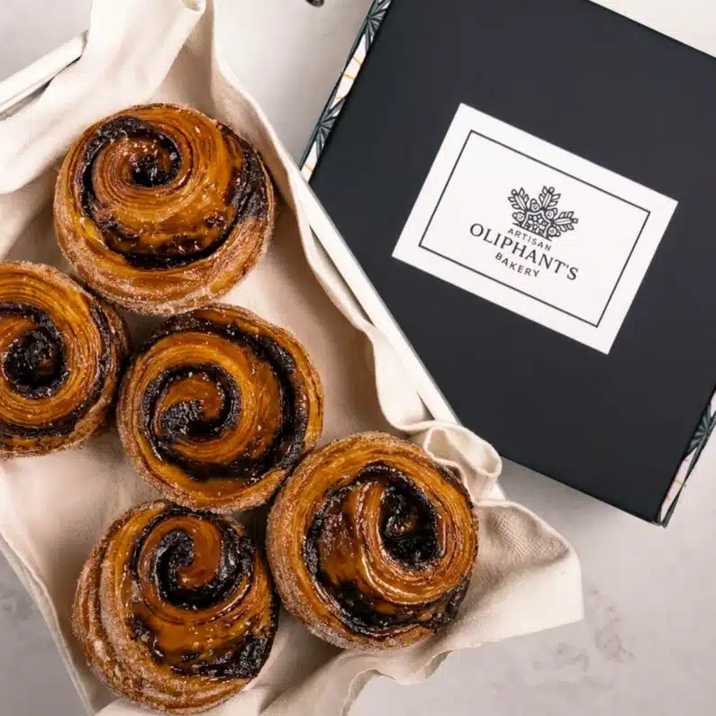Decadent dark chocolate and salted caramel pastry in a small bakery box, offering a perfect balance of sweet and savory