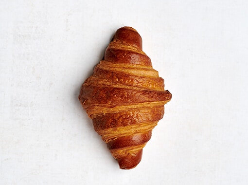 Cinnamon bun with a soft, fluffy texture and a generous swirl of spiced cinnamon, perfect for a comforting treat